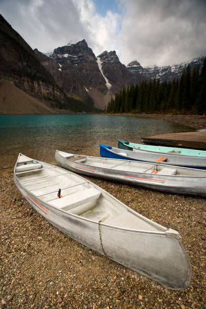 istock Canoes by a lake 173585283