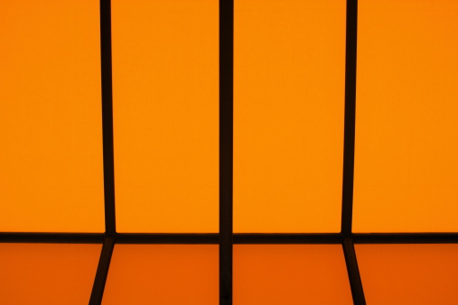 Orange canvas awning panel design provides symmetrical architecture background.  San Francisco, California, 2008.