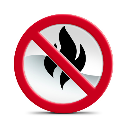 Isolated on white forbidden sign with a flame on. 