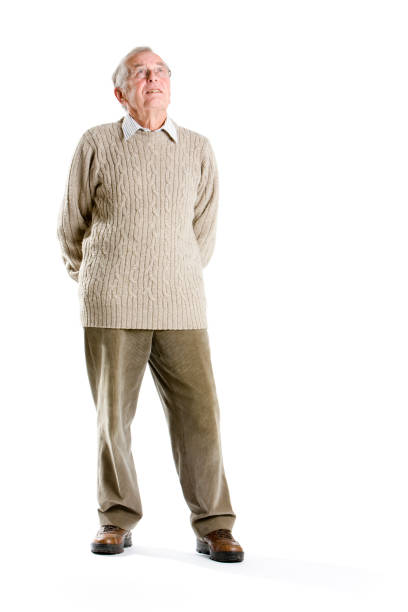 istock Senior man looking up with his arms crossed behind his back. 173586252