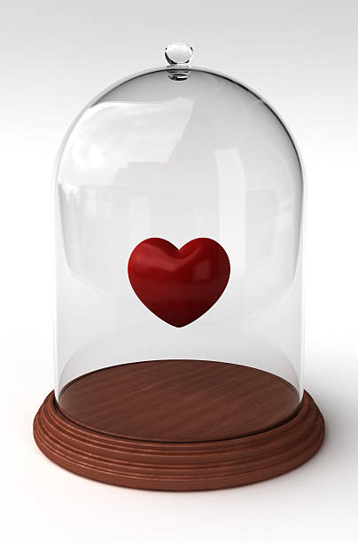 Bell-jar with red heart inside stock photo