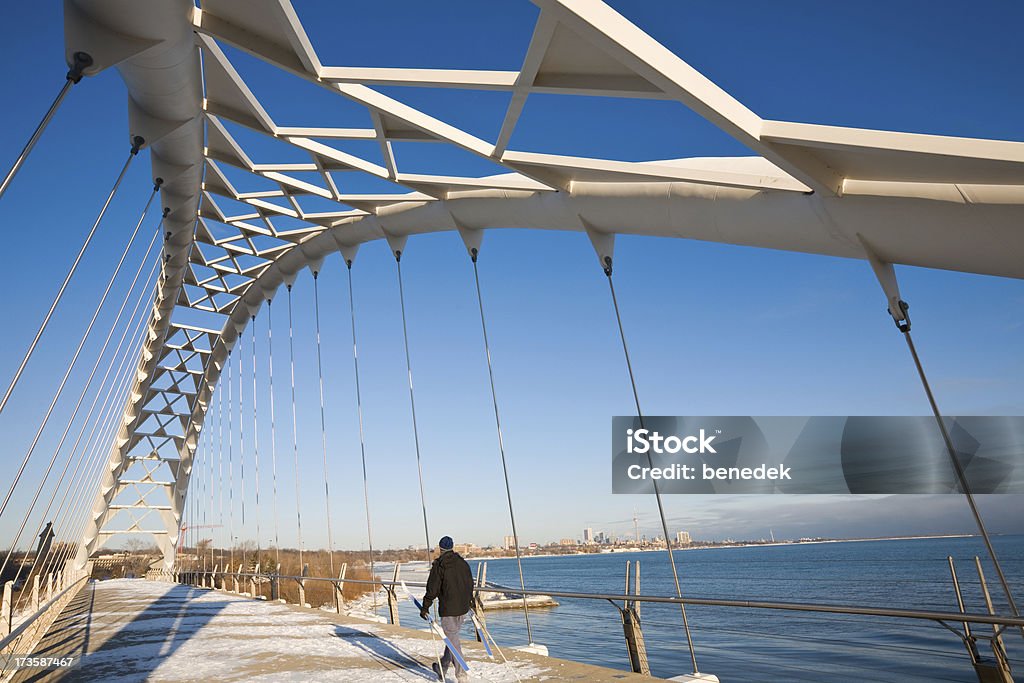 Toronto Winter "Cross Country skier crossing bridge, Toronto downtown in the backgroundSee more images of Toronto:" Toronto Stock Photo