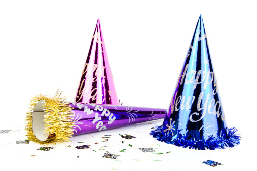 New Year's hats and horn isolated on white background.