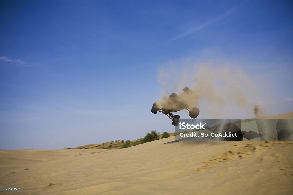 Flying RC Car RC dune buggy going for a fly after hitting a sand jump. Car Stock Photo