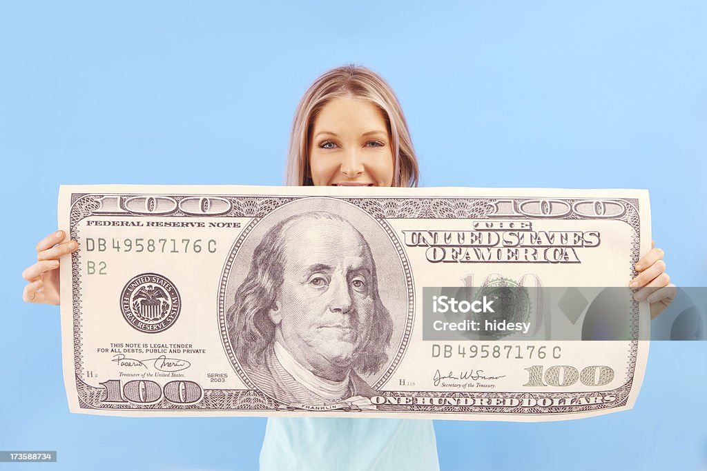 Big Money Woman on blue with big money Winning Stock Photo