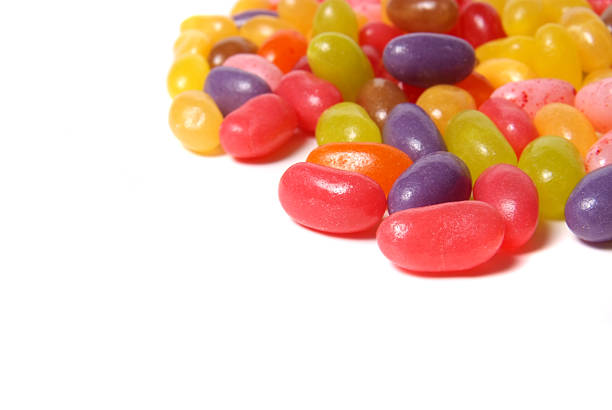 istock Many multicolored jelly beans on a white background. 173588820