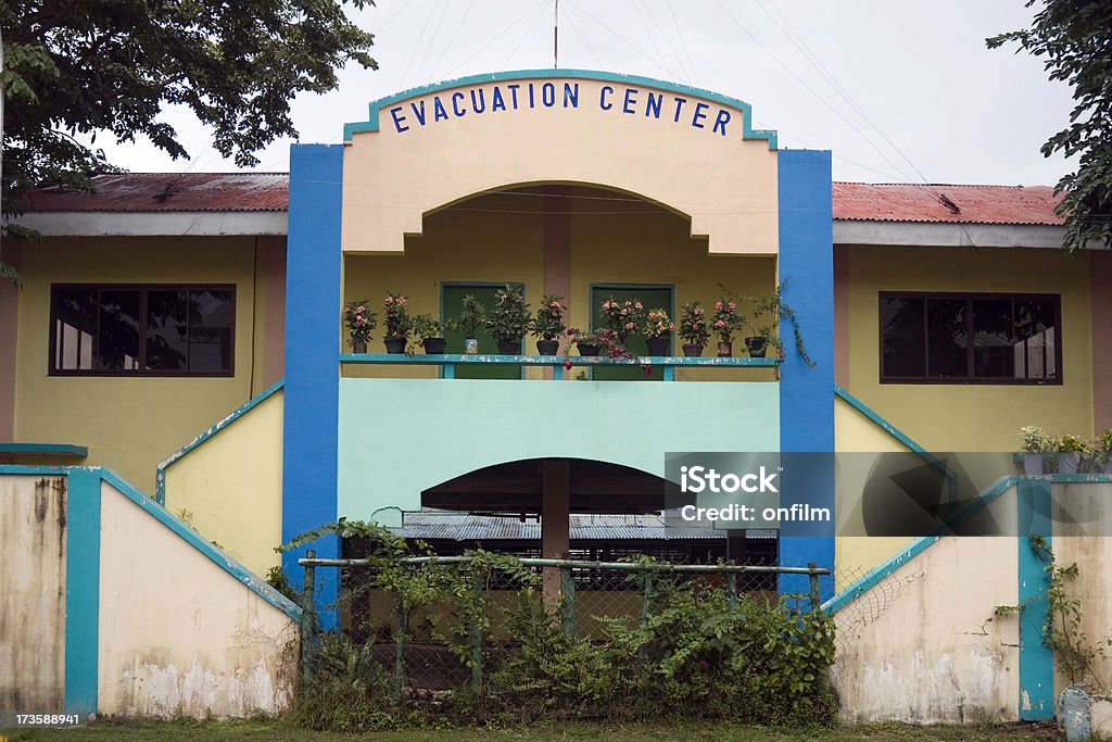 Flood evacuation centre "Evacuation Centre in a village in the Phillipines. Flooding is now so common in the rainy season that a permanent centre has been built. Location is Bula, province of Camarines Sur, region of Bicol, island of Luzon." Charity and Relief Work Stock Photo