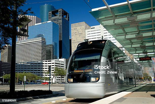 Metro Train At Platform With Modern Skyscrapers In Background Stock Photo - Download Image Now
