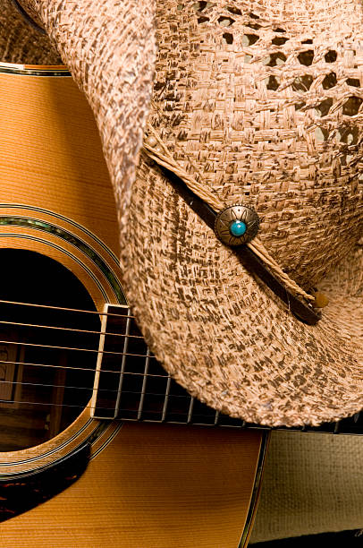 istock Acoustic Guitar and Cowboy hat 173589316