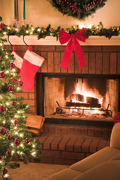 istock Comfortable sofa by blazing fireplace and decorated Christmas tree 173589671