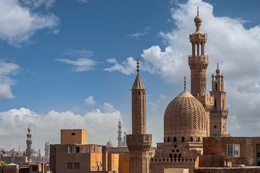 View of several ancient mosques in the old market area of Cairo.