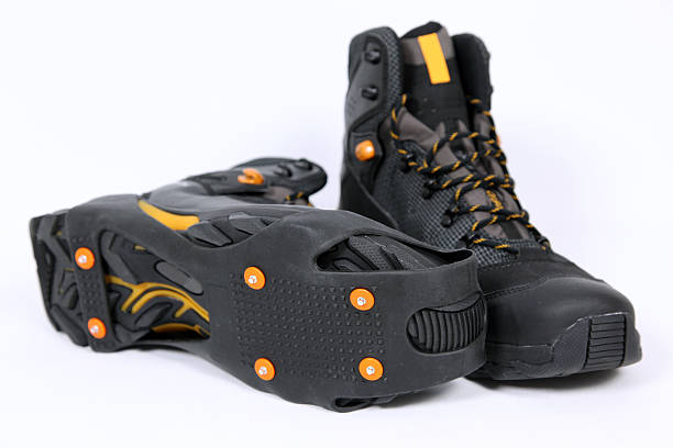 istock Trekking Boots with Crampons Isolated on White Background 173590340