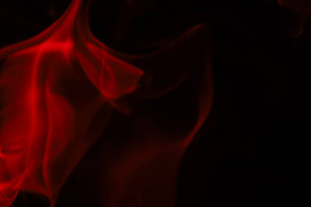 istock Red smoke on a dark background, colourful abstract 1735904037