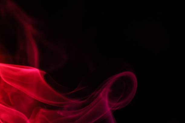 istock Red smoke on a dark background, colourful abstract 1735904068
