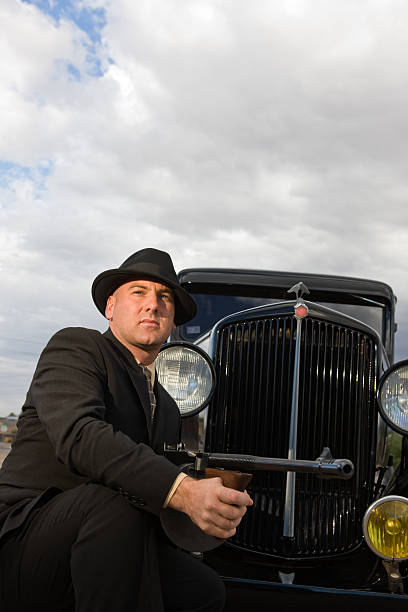 istock 1920's Style Vintage Car and Mobster 173590802
