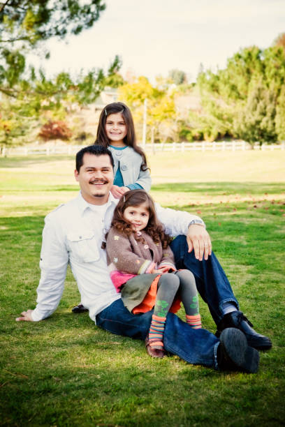 istock family portrait with dad and daughters 173590823