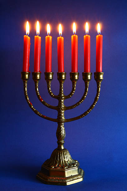 Jewish candle holder with seven lit candles