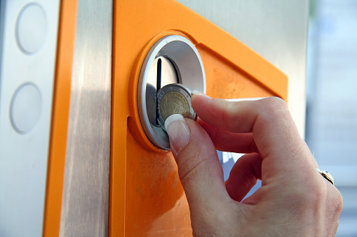 Inserting a coin in a cash machine