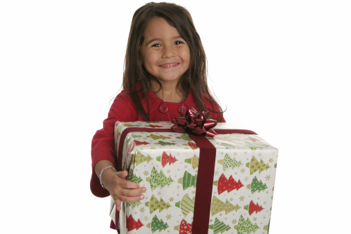 Beautiful Hispanic Child holding a Christmas Present