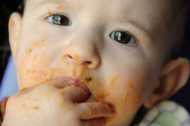 istock dirty baby eating 173591859