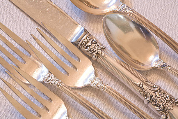 fine dining elegant antique silverware place setting - bestek stockfoto's en -beelden