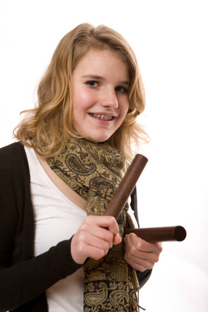 istock Young girl is playing the woodblocks 173592118