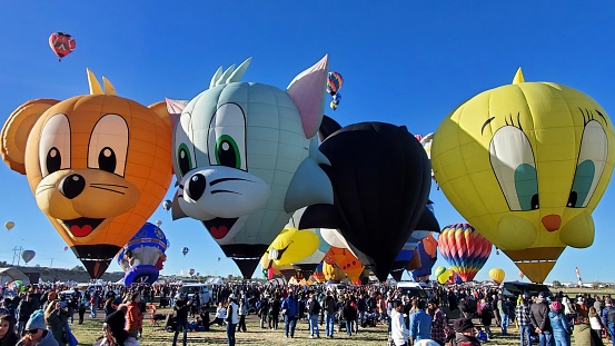 On the Special Shapes day of the Albuquerque Balloon Fiesta cartoon characters smile down on the visitors.
