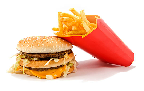Tasty hamburger and french fries on a white background