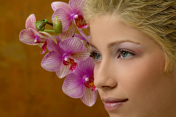 istock Girl with orchid 173594021