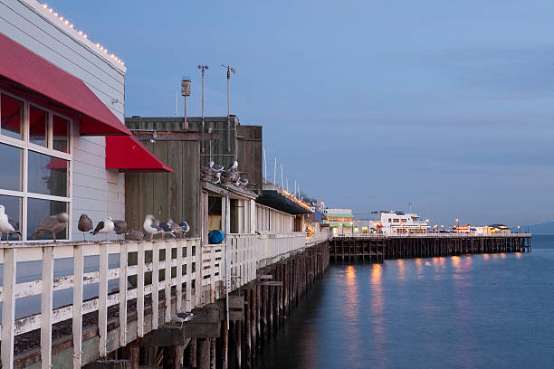 The waterside Santa Cruz boardwalk at dusk stock photo