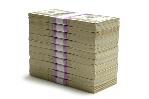 Tall Stack of Bundled One Hundred Dollar Bills on White.