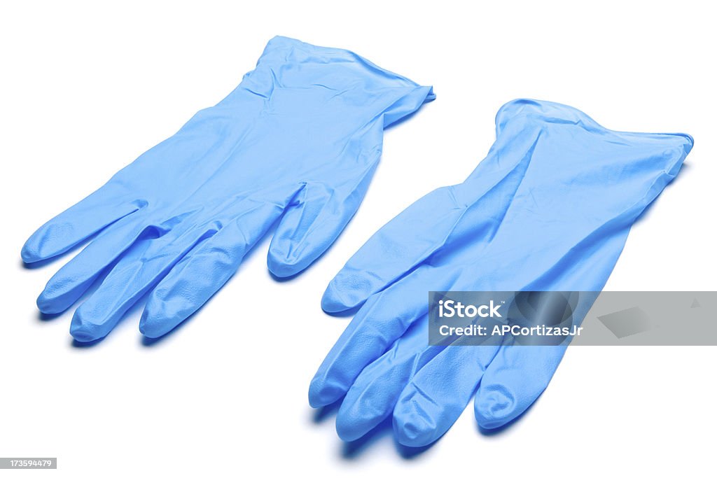 Paire de gants chirurgicaux bleu sur fond blanc - Photo de Gant de chirurgie libre de droits
