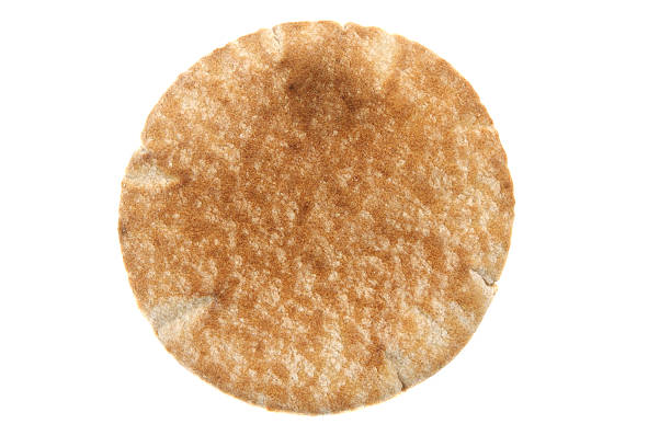 Pita Bread Piece of wheat pita bread on a white background pita bread isolated stock pictures, royalty-free photos & images