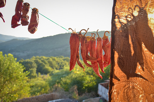 Dried chilies hanging on a rope in a village, Berovo, Macedonia