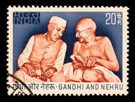 Issued in 1973 to commemorate the 25th anniversary of India's independence. Mahatma Gandhi and Jawaharlal Nehru (India's first Prime Minister) are depicted enaging in a friendly dialog. DSLR with 100mm macro; no sharpening.