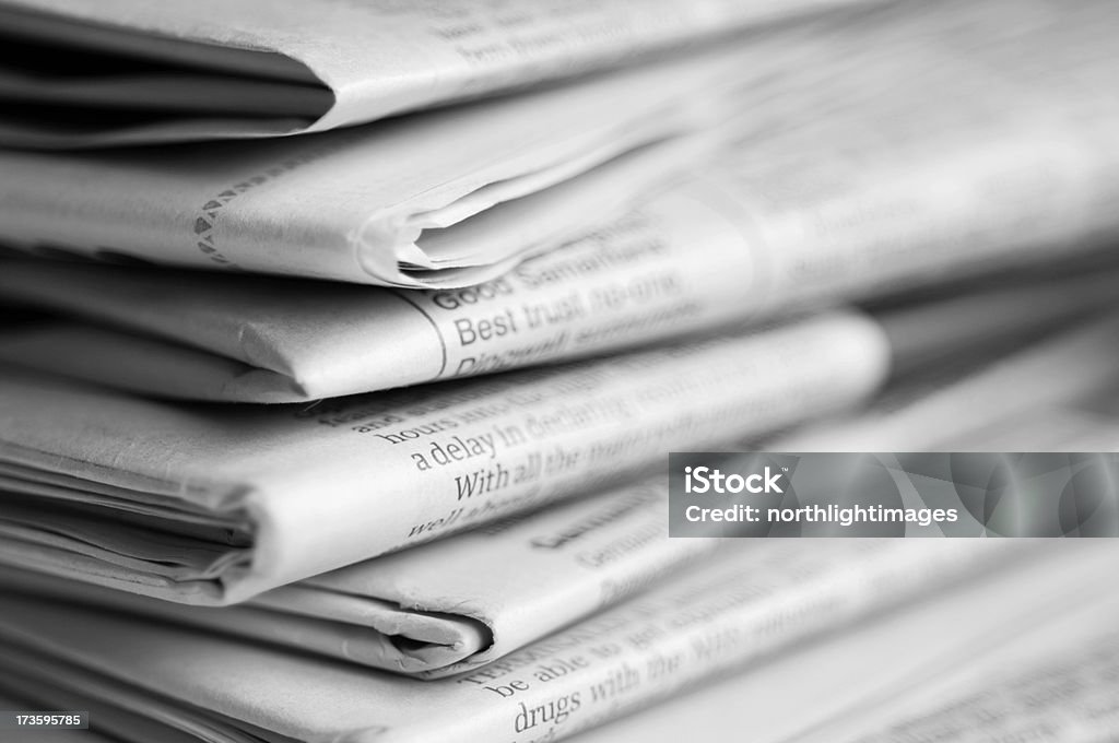 Stack of newspapers Close up of a stack of newspapers. Shallow depth of field. Black And White Stock Photo