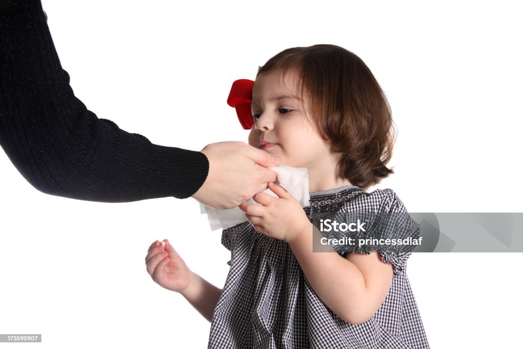 Clean Up Mother wiping her toddlers face with a wet wipe Child Stock Photo