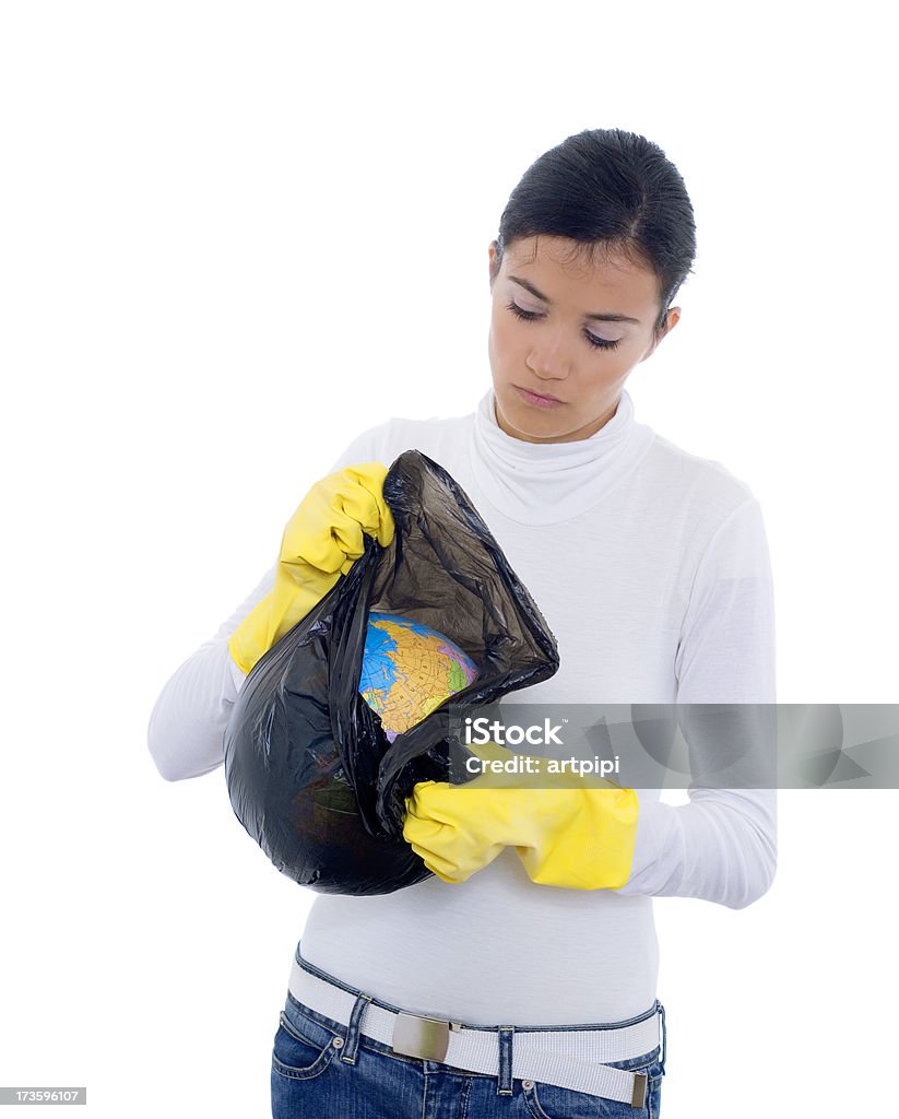 save the planet! young woman with gloves holding the planet in garbage bag Adult Stock Photo