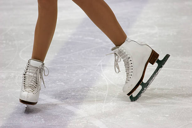 Close up of figure skaters feet in skates on ice legs in skates hockey skate stock pictures, royalty-free photos & images