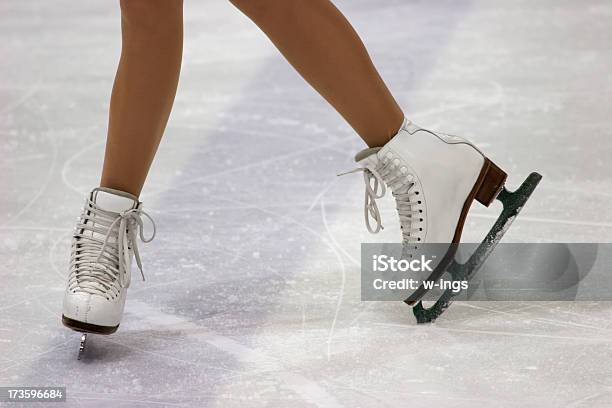 Close Up Of Figure Skaters Feet In Skates On Ice Stock Photo - Download Image Now - Figure Skating, Ice Skate, Women