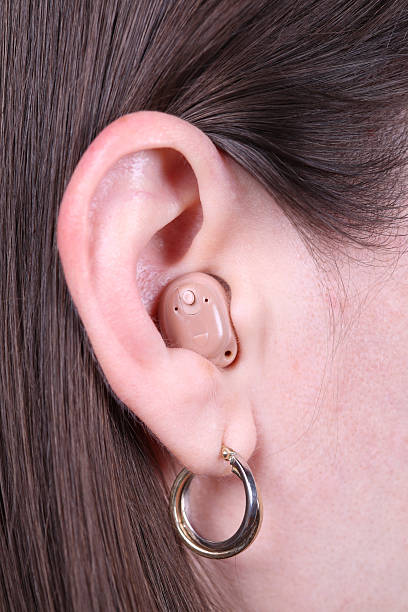 istock Brunette Woman with Modern Hearing Aid Wide Upright 173596858