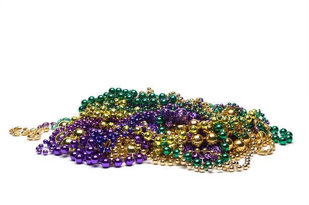 Mardi Gras Beads "Purple, green and gold Mardi Gras beads.Other images in this series:" bead photos stock pictures, royalty-free photos & images
