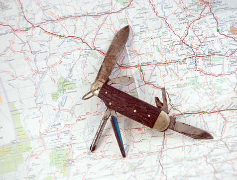 An antique hunting/camping knife on a map of Australia. Copy space