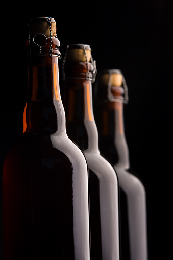 Three corked beer bottles