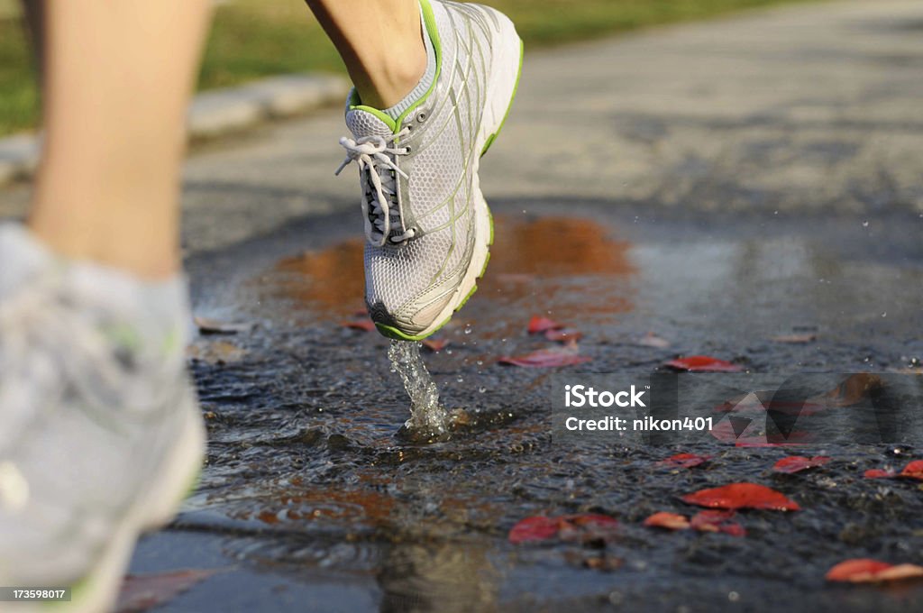 Deep Puddle Running Running Through Puddle Stock Photo - Download Image Now - Autumn ...