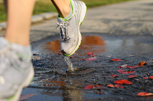 Running Through Puddle stock photo