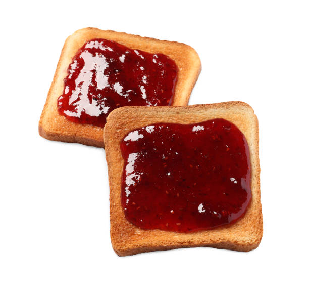 istock Delicious crispy toasts with berry jam on white background 1735980749