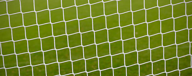 Empty soccer field, close-up of the goal net stock photo