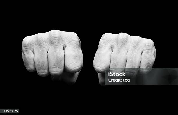 Black And White Image Of Clenched Fists Stock Photo - Download Image Now - Beauty, Black And White, Black Background