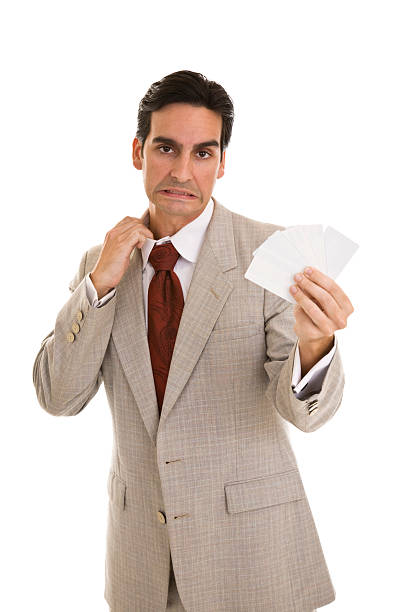 istock Uncomfortable Businessman holding blank cards 173598719